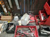 many tools that are sitting on the floor in the garage