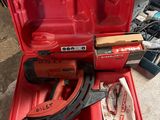 a red tool case with tools in it on the floor