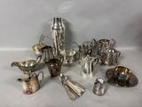 a lot of silver items that are on the table