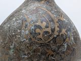 a large vase with a design on it on a table