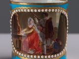 a cup with a picture of a man and a woman on it