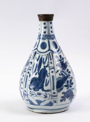 a blue and white vase with a picture of a cat on it