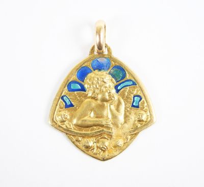 an image of a gold pendant with an angel on it