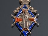 an image of a blue and silver medal with a crown on it