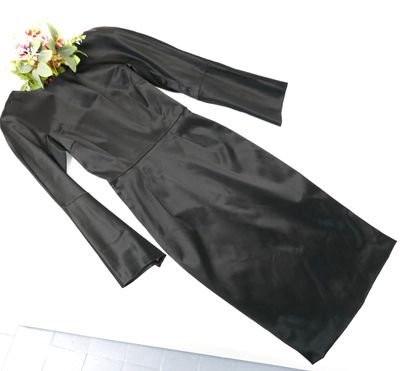 a picture of a black dress with a flower on top of it