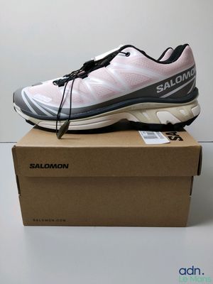 a close up of a shoe on a box on a table