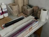 a picture of a workbench with a roll of paper and a roll of toilet paper on it