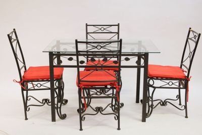 dining table with four chairs and a glass top