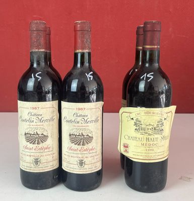 trois bouteilles de vin sont alignées sur un comptoir