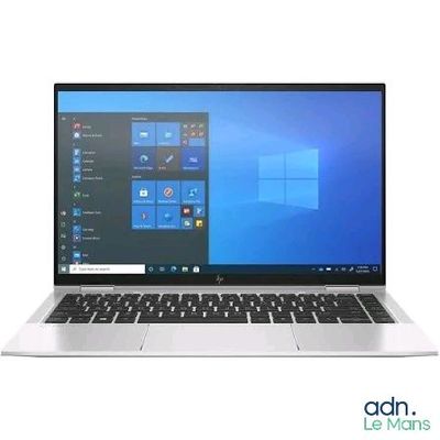 un ordinateur portable ouvert posé sur une surface blanche