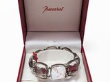 an image of a red bracelet with a silver clasp in a red box