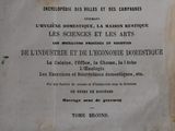an old book with french writing on it sitting on a table