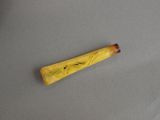 a close up of a wooden stick with a design on it