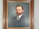 painting of a bearded man in a suit and tie in a wooden frame