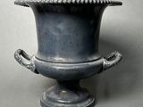 an image of a vase with a handle on it