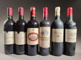 several bottles of wine are lined up on a table