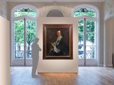 painting of a man standing in front of a painting in a room