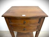 a small wooden table with a drawer on top of it
