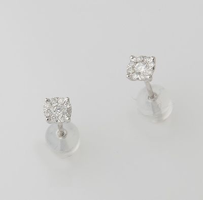 a pair of diamond stud earrings