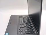 a laptop that is sitting on a white table