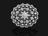 a diamond and white gold broochle, by van cleef