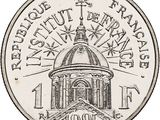 a close up of a coin with a building in the background