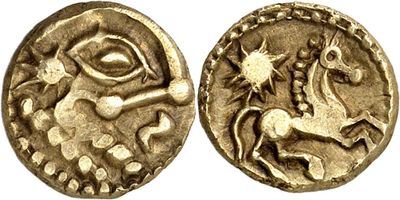 a gold coin with an image of a horse on it