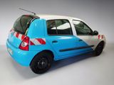 a small blue and white car with a red and white stripe