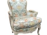 an image of a chair with a floral upholstered back and arms