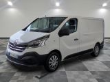 the white van is parked on a checkered floor in a room