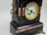 a clock that is sitting on a table next to a key