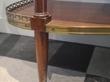 a table with a shelf on top of it in a room