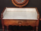 a small table with a mirror on top of it
