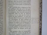 an open book with a handwritten text on it sitting on a table