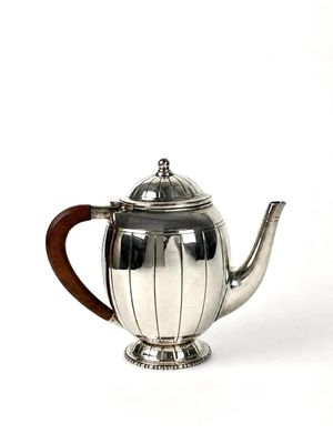 Verseuse en métal argenté ovoïde d'époque Art Déco