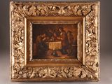 painting of a group of people sitting around a table in a gold frame