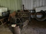 a horse standing in a barn with other horses