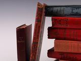 a stack of books sitting on top of each other on a table