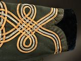 a close up of a military uniform with a knot on it