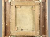 an old wooden picture frame with a picture of a person in it