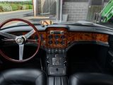 a dashboard and steering wheel of a classic car