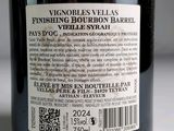 a label on a bottle of wine on a table