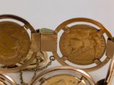 a gold bracelet with a coin on it and a watch on it