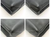 four different shots of a black purse with a wooden handle