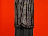 an image of a black and white dress on a mannequin