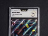 a close up of a pokemon card on a black surface