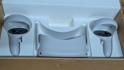 a box with two wii controllers in it on a table