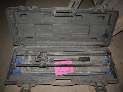 a tool case with tools in it sitting on the floor