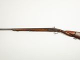 a rifle with a wooden barrel on a white background