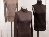 three mannequins on display in front of a white wall